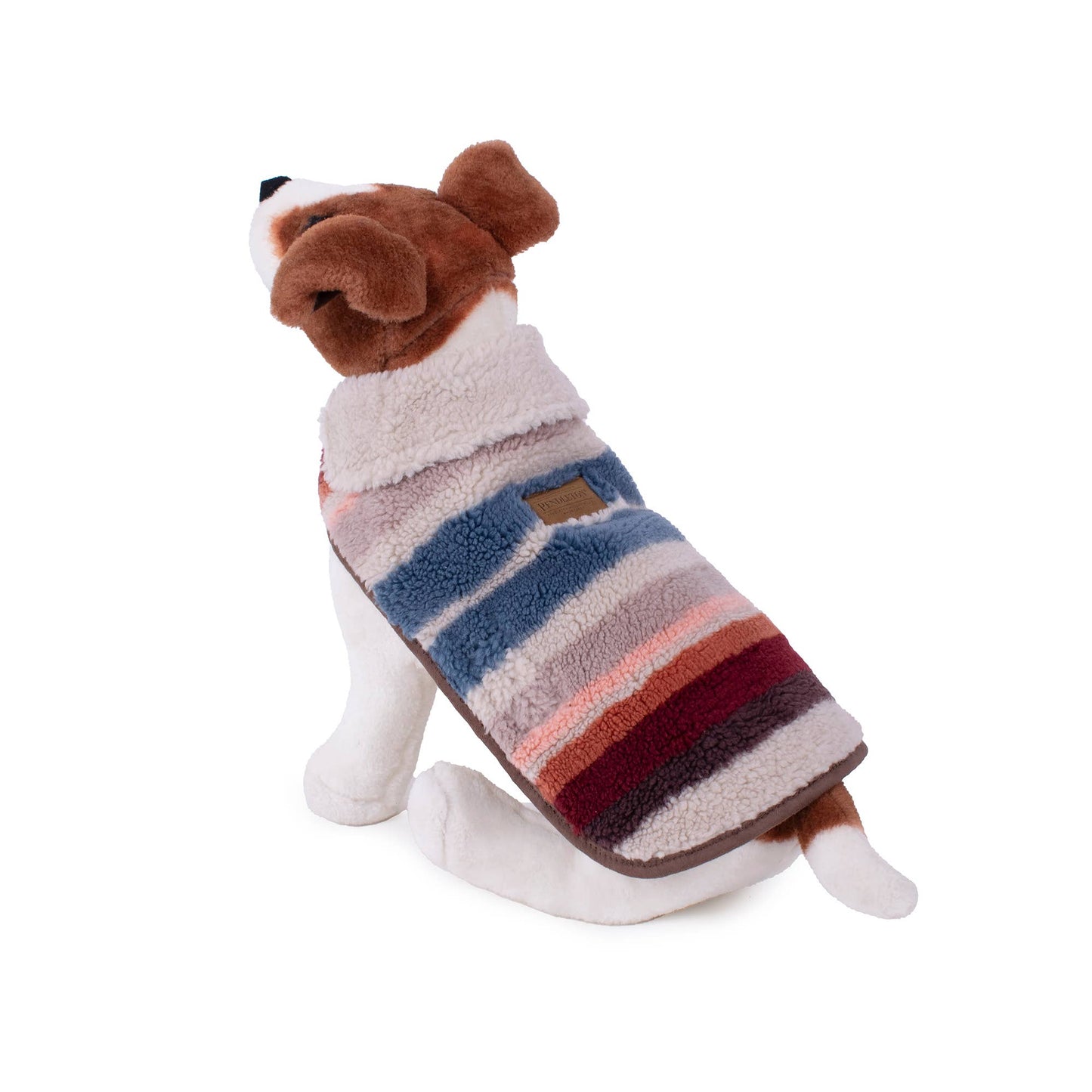 A cozy and stylish dog coat featuring a colorful Serape Rosewood pattern with warm tones of red, orange, and brown. The coat is made of soft Berber fleece and includes adjustable straps for a secure fit. The design incorporates a Southwestern-inspired look, with a blend of traditional and modern elements, offering both comfort and fashion for your pet.